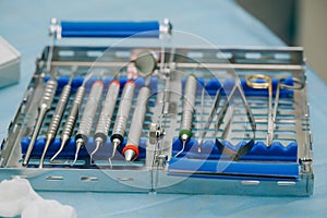 Dentist orthopedist tools. Dental implantation surgical set. Surgical kit of instruments used in dental implantology.