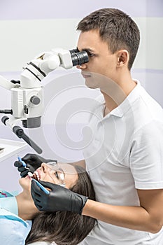 Dentist with patient in clinic