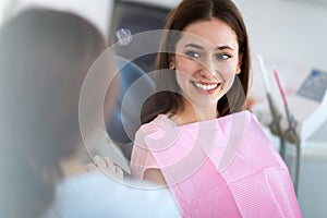 Dentist and patient in dentist office