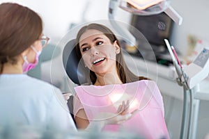 Dentist and patient in dentist office