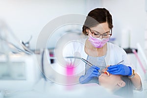 Dentist and patient in dentist office