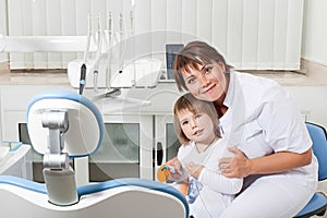 Dentist and patient smiling