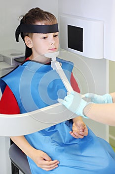 Dentist prepare boy to jaw x-ray image photo