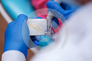 Dentist prepares solution for seals