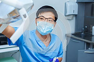 Dentist preparing his workplace in the dental office. Dentistry,