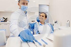 Dentist preparing medical tools for patient