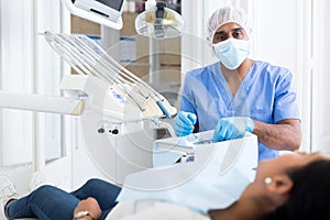 Dentist preparing special medical tools in dental office