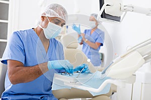 Dentist preparing special medical tools in dental office