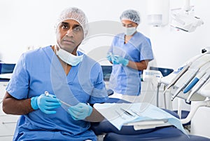 Dentist preparing special medical tools in dental office