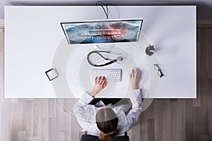 Dentist`s Hand Examining Teeth X-ray