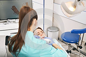Dentist scanning woman teeth with intraoral 3D scanner