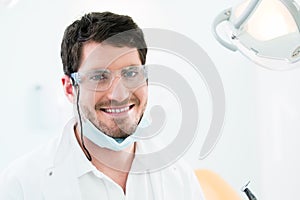 Dentist standing in dental surgery