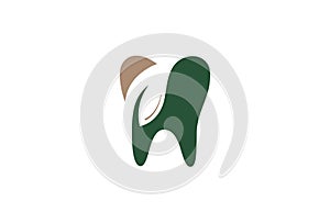 Dentist Symbol Design. Vector Logo Template. Vector emblem of a tooth with a negative leaf above it as a trendy logomark of green