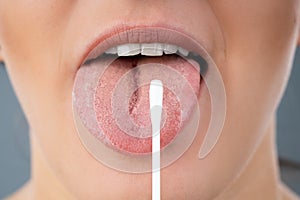 Taking Saliva Test From Woman`s Mouth photo
