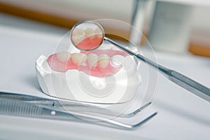 Dentist tools with acrylic denture (False teeth)