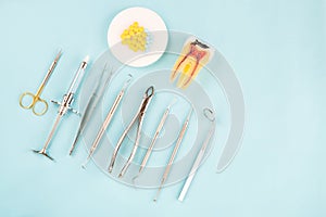 Dentist tools on the blue background.