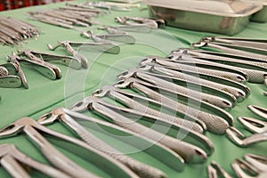 Dentist tools on green background