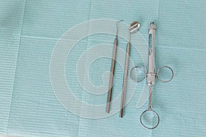 Dentist tools on light blue background. Dental hygiene and healthcare concept