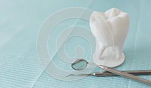 Dentist tools on light blue background. Dental hygiene and healthcare concept