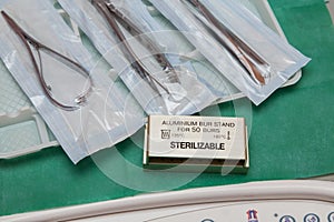 Steril dentist tools on a plastic plate photo