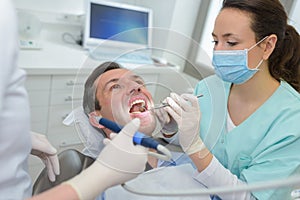 Dentist treating a customer