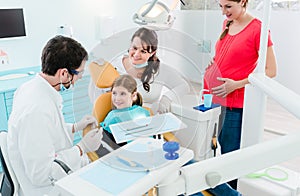 Dentist treating the whole family in his office