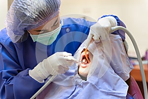 Dentist treatment teeth cavity with Patient while holding air water syringe machine