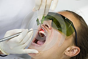 Dentist using a modern diode dental laser