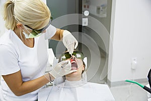 Dentist using a modern diode dental laser