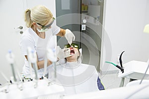 Dentist using a modern diode dental laser