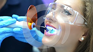 Dentist using ultraviolet lamp