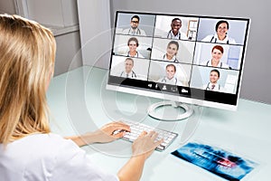 Dentist Video Conferencing With Her Colleagues On Computer