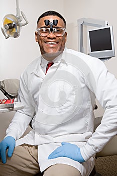 Dentist wearing dental binocular loupes