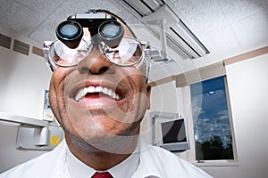 Dentist wearing dental binocular loupes