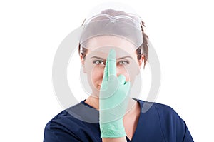 Dentist woman lifting protective glasses or screen