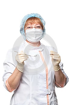 Dentist woman mask holding tools ready to operate