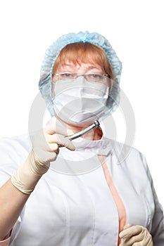 Dentist woman mask holding tools ready to operate