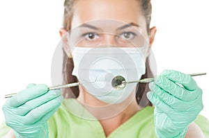 Dentist woman showing her professional tools