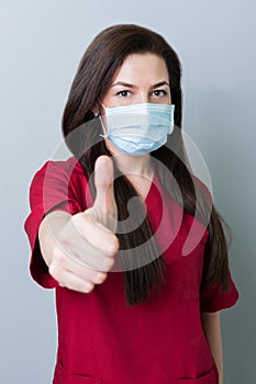 Dentist woman showing thumbup