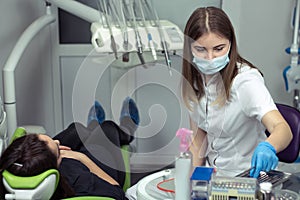 Dentist at work preparing instruments in dental clinic