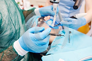 Dentist working with stop filling at dentistry office