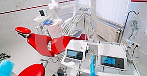 dentistry, medicine, medical equipment and stomatology concept - interior of new modern dental clinic office with chair