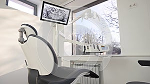 Dentistry office with professional modern equipment. Empty minimalistic stomatology office with dental unit, chair and