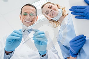 Dentists checking patient teeth