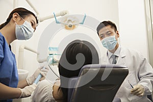 Dentists Examining Female Patient