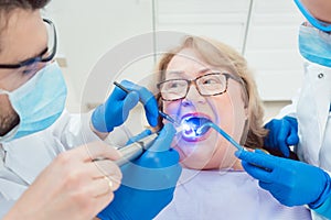 Dentists hardening toot crown with UV light