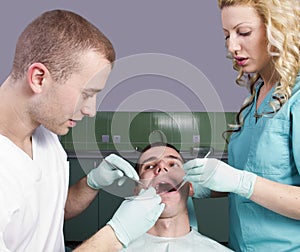 Dentists working on a patient