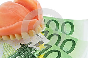 Denture and euro bills