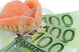 Denture and euro bills photo