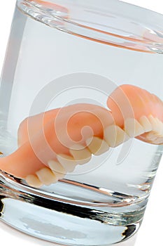 Denture in water glass photo